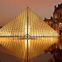 Pyramid of Louvre at night in Paris, France