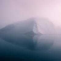 Misty Iceberg on the Sea in Greenland