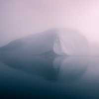 Misty Iceberg on the Sea in Greenland