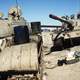 Two Iraqi tanks lie abandoned near Kuwait City in Gulf War