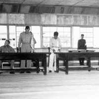 Delegates sign the Korean Armistice Agreement in P'anmunjŏm