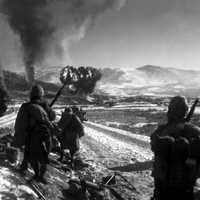 Marines watching explosions to flush out enemies, Korean War