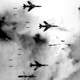  B-66 Destroyer and four F-105 Thunderchiefs dropping bombs in the Vietnam War