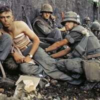 Marine gets his wounds treated during operations in Huế City, 1968 during Vietnam War