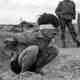 Viet Cong prisoner captured in 1967 by the U.S. Army awaits interrogation during Vietnam War