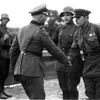 German and Soviet army officers pictured shaking hands After the division of Poland, World War II