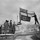 Seamen raise the White Ensign over a captured German U-boat in World War II