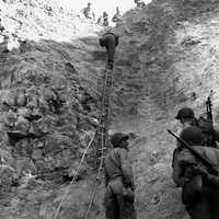 U.S. Rangers scaling the wall at Pointe du Hoc , Normandy, World War II