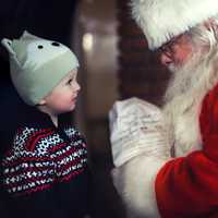 Santa talking with a young child