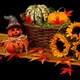 Two small Halloween Pumpkin Jack-O-Lantern with basket of pumpkins