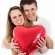 Couple holding heart balloon on Valentine's day