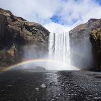 Waterfall and rainbow wide-angle