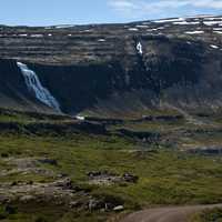 Waterfall scenery into valley in Iceland