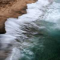 Waves and Surf crashing on shore in Iceland