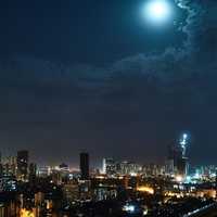 Moon in the sky over the city