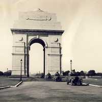 Armoured cars passing through India Gate in 1930s in Delhi