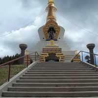 Stupa in India surrounded by clouds 