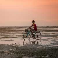 Man on Bicycle in Indonesia