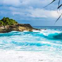 Waves on the ocean crashing on shore in Indonesia