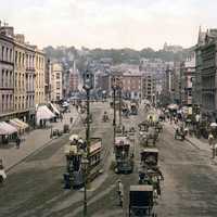 Patrick Street around 1900 with cars and people in Cork, Ireland