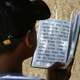 Reading a prayer book in Jerusalem, Israel