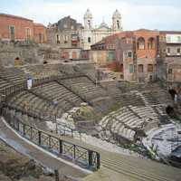 The Church of Saint Francis of Assisi backs the Cavea of the Greek-Roman Theatre in Catania, Italy
