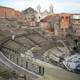 The Church of Saint Francis of Assisi backs the Cavea of the Greek-Roman Theatre in Catania, Italy