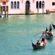 Boats coming down the grand Canal in Venice, Italy