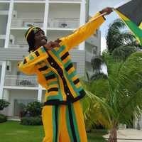 Man holding Jamaican Celebration Flag