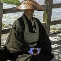Monk waiting for offerings in Kyoto, Japan