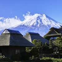 Mount Fuji rising above houses in Japan