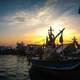 Boats in the Harbor at sunset in the Maldives