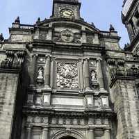 Main portal with view of clock at the Mexico City Cathedral