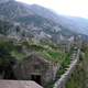 Stairs and mountainside stone buildings in Kotor, Montenegro