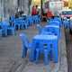 Teashop on Pavement with blue plastic tables