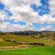 Village in the foothills landscape with sky and clouds in Nepal