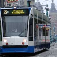 Tram on Damrak in Amsterdam, Netherlands