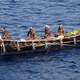 Natives in a boat in Papua New Guinea