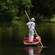 Boatman taking guests on a canoe