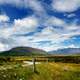 Hills and the New Zealand under the sky and clouds