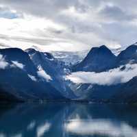 Scenic landscape with lake and landscape with clouds