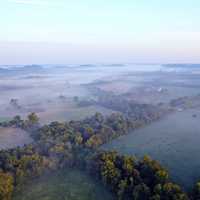 Aerial View of forests under fog