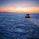Car on frozen Lake Baikal with snow and ice