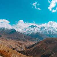 Clouds Across Snow-capped Mountain peaks