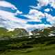 Clouds over the mountain landscape with blue sky