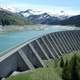 Dam Bridge with lake and mountains in the background