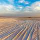 Desert Tracks under blue sky and clouds