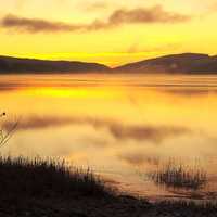 Fog and Mist over the lake landscape at Sunset