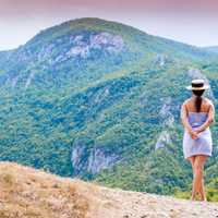 Girl looking at mountains landscape