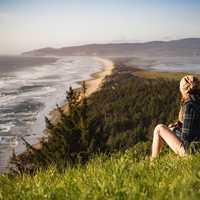 Girl looking at the coastline landscape